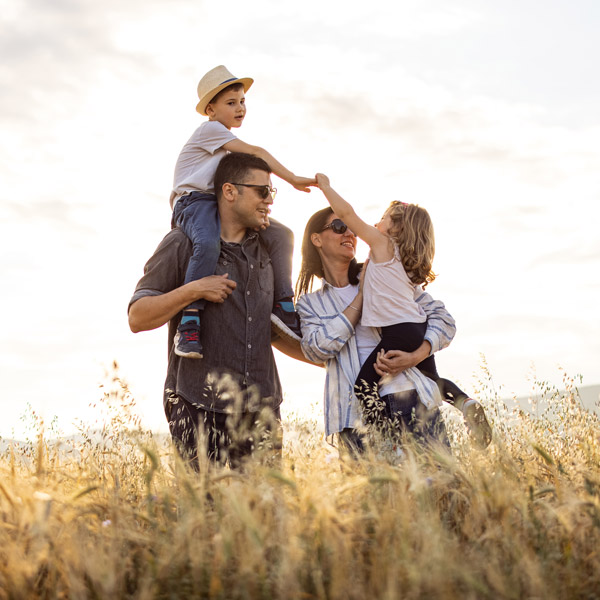 A family enjoys a sunny day in a field