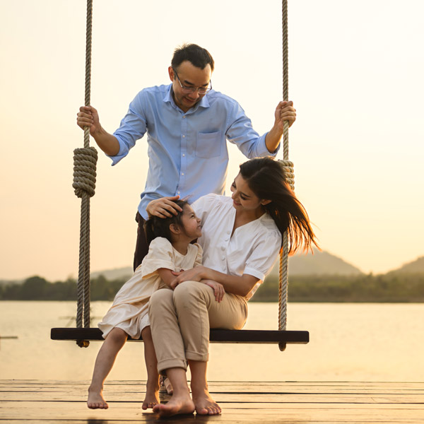 A family enjoys on a swing