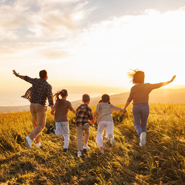 Family running in the field