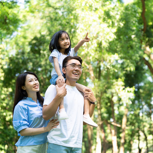 A family walking in a garden
